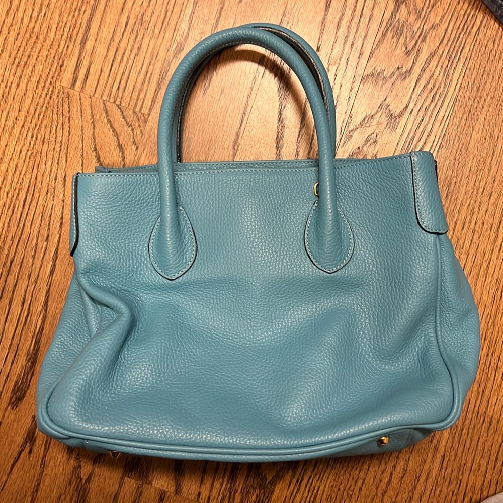 New without tags. Never used, sky blue leather bag, courage b.